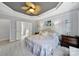 Serene Primary bedroom with soft lighting, tray ceilings, and neutral tones creates a peaceful retreat for rest and relaxation at 2224 Hartwell Ln, Fort Mill, SC 29707