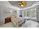 Relax in style in this Primary bedroom, featuring a tray ceiling, large windows, and access to a private outdoor deck at 2224 Hartwell Ln, Fort Mill, SC 29707