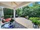 Outdoor patio with a covered seating area, potted plants, and a grill at 2224 Hartwell Ln, Fort Mill, SC 29707