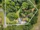 Beautiful aerial view of the property highlighting the surrounding lush trees and landscaping at 2320 Doster Rd, Monroe, NC 28112