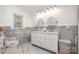 Bathroom with double vanity, marble tile, and elegant fixtures at 2320 Doster Rd, Monroe, NC 28112