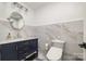 Bathroom with granite countertops, blue vanity, and white toilet at 2320 Doster Rd, Monroe, NC 28112