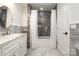 Stylish bathroom with marble countertop, tub, and shower at 2320 Doster Rd, Monroe, NC 28112