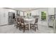 This modern kitchen boasts white cabinets, a large island, stainless appliances, and stone countertops at 2320 Doster Rd, Monroe, NC 28112