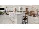 Open floor plan, featuring a kitchen island, white cabinets, and a dining area at 2320 Doster Rd, Monroe, NC 28112