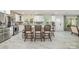 Bright, open kitchen featuring white cabinets, stainless appliances, a kitchen island, and marble flooring at 2320 Doster Rd, Monroe, NC 28112