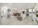 Open-concept kitchen featuring an island and white cabinetry connected to the dining area at 2320 Doster Rd, Monroe, NC 28112