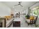 Bright and airy living room with updated flooring, modern ceiling fan, and open floor plan at 2320 Doster Rd, Monroe, NC 28112