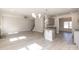 Bright and open living area with hardwood floors, fireplace, and modern lighting fixtures at 236 Mountain Island Rd # 40, Statesville, NC 28677