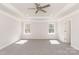 Spacious main bedroom featuring trey ceilings, recessed lighting, and two bright windows at 236 Mountain Island Rd # 40, Statesville, NC 28677