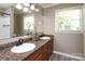 Bathroom features a dual sink vanity with granite countertop and decorative fixtures at 2443 Knickerbocker Dr, Charlotte, NC 28212