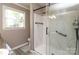 Bathroom showcasing dual sinks, stylish granite countertops, and a sleek glass shower at 2443 Knickerbocker Dr, Charlotte, NC 28212