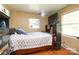Cozy bedroom featuring hardwood floors, large window, and comfortable full sized bed at 2443 Knickerbocker Dr, Charlotte, NC 28212