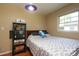 View of a bedroom with hardwood floors, large window, and comfortable full sized bed at 2443 Knickerbocker Dr, Charlotte, NC 28212