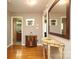 Hallway featuring hardwood floors, elegant console table and decor at 2443 Knickerbocker Dr, Charlotte, NC 28212