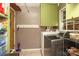 Functional laundry room featuring tile floors and modern washer and dryer at 2443 Knickerbocker Dr, Charlotte, NC 28212