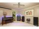 Living room featuring a piano and a doorway to the kitchen, creating an inviting, connected living space at 2443 Knickerbocker Dr, Charlotte, NC 28212