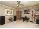 Spacious living room featuring neutral walls, guitars on the wall, and a ceiling fan at 2443 Knickerbocker Dr, Charlotte, NC 28212