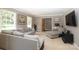 Inviting living room showcasing a sectional sofa, natural light, and entertainment area at 2443 Knickerbocker Dr, Charlotte, NC 28212