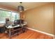 Bright office with a large window and hardwood floors offering a perfect workspace at 2443 Knickerbocker Dr, Charlotte, NC 28212