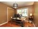 Well-lit home office space with hardwood floors and a large window perfect for productivity at 2443 Knickerbocker Dr, Charlotte, NC 28212