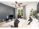 Cozy bedroom with accent wall, a ceiling fan, and natural light at 2548 Chasewater Dr, Fort Mill, SC 29707