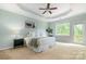Serene bedroom with tray ceiling, and private balcony access, offering a relaxing retreat at 2548 Chasewater Dr, Fort Mill, SC 29707