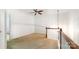 Well-lit upstairs hallway with chandelier and ceiling fan, leading to bedrooms at 2548 Chasewater Dr, Fort Mill, SC 29707