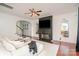 Inviting living room with hardwood floors, fireplace, and an abundance of natural light at 2548 Chasewater Dr, Fort Mill, SC 29707