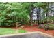 Pathway with stairs and wooden railing surrounded by lush trees and greenery at 2548 Chasewater Dr, Fort Mill, SC 29707