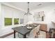 Elegant dining room with modern chandelier and wainscoting at 2548 Chasewater Dr, Indian Land, SC 29707