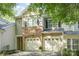 Charming townhome featuring a stone facade and two-car garage for convenient parking at 2548 Chasewater Dr, Indian Land, SC 29707