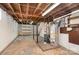 Unfinished basement with utility equipment, concrete floor, and exposed ceiling at 300 Caldwell St, Kannapolis, NC 28083