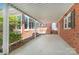 Covered carport with brick pillars, brick wall, and concrete flooring, ideal for all weather at 300 Caldwell St, Kannapolis, NC 28083