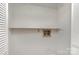 Laundry room with white walls, shelving, and water connections for appliances at 300 Caldwell St, Kannapolis, NC 28083