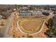 Aerial view showcases the community's pond, walking trail, and townhome exteriors at 3321 Treble Ct, Charlotte, NC 28262
