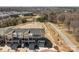 Aerial view of community featuring pond and landscaping at 3321 Treble Ct, Charlotte, NC 28262