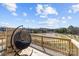 Charming back deck featuring a unique hanging chair and scenic pond views at 3321 Treble Ct, Charlotte, NC 28262