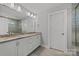 Bathroom featuring dual sinks with granite counters and tiled floors at 3321 Treble Ct, Charlotte, NC 28262