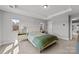 Comfortable bedroom with tray ceiling and natural light from multiple windows at 3321 Treble Ct, Charlotte, NC 28262