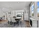 Open dining area next to the kitchen with modern decor and large windows at 3321 Treble Ct, Charlotte, NC 28262