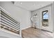 Modern entrance with a view to the stairs, shelves, and a door that offers views of the outside at 3321 Treble Ct, Charlotte, NC 28262