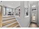Bright entryway featuring wood stairs, modern railing, and door with sidelights at 3321 Treble Ct, Charlotte, NC 28262
