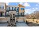 Contemporary townhome featuring mixed material facade, balcony, and a two-car garage at 3321 Treble Ct, Charlotte, NC 28262
