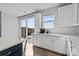 Bright kitchen with a breakfast bar, outside deck and windows with a view of the neighborhood at 3321 Treble Ct, Charlotte, NC 28262