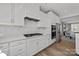 Contemporary kitchen with stainless steel appliances, custom white cabinetry and quartz countertops at 3321 Treble Ct, Charlotte, NC 28262