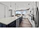 Beautiful kitchen with a breakfast bar and stainless steel appliances with easy access to the outdoor patio at 3321 Treble Ct, Charlotte, NC 28262