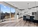 Bright kitchen featuring a large island, white cabinets, and a sliding glass door to the deck at 3321 Treble Ct, Charlotte, NC 28262
