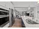 Modern kitchen with stainless appliances, a stylish faucet, an island with an undermount sink, and lots of storage at 3321 Treble Ct, Charlotte, NC 28262