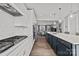 Spacious kitchen with a gas cooktop, stainless appliances, ample counter space, and a large island at 3321 Treble Ct, Charlotte, NC 28262